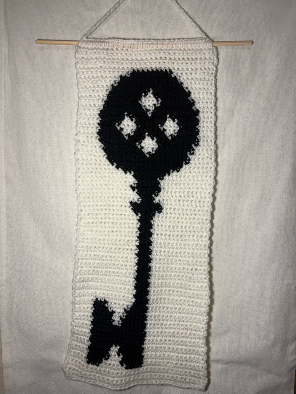 Handmade Crocheted Wall Hanging with Black Key Motif